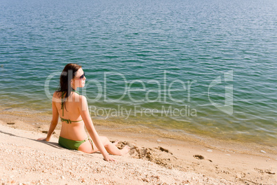 Summer woman in bikini alone on beach