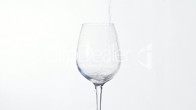 Fresh water pouring into glass