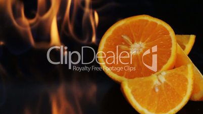 Orange fruit in fire flame