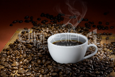 Coffee cup with roasted beans