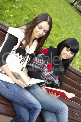 Mom and daughter reading a book