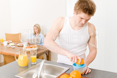 Breakfast happy couple make orange juice morning