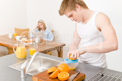 Breakfast happy couple make orange juice morning