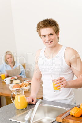 Breakfast happy couple make orange juice morning