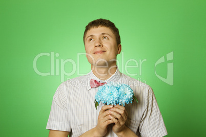 Lover man "nerd" with a bouquet of flowers