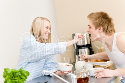 Breakfast happy couple woman feed man cereal