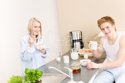 Breakfast happy couple eat cereal drink coffee