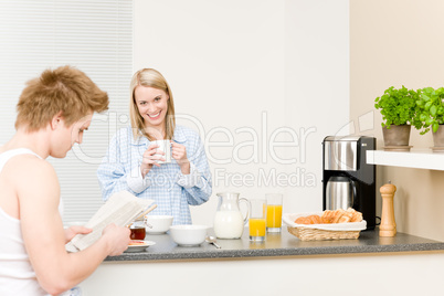 Breakfast happy couple drink coffee read newspaper