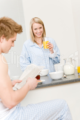 Breakfast happy couple eat cereal drink juice