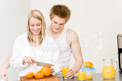 Breakfast happy couple make orange juice morning