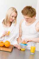 Breakfast happy couple make orange juice morning