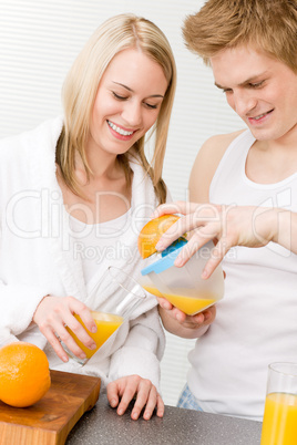 Breakfast happy couple make orange juice morning