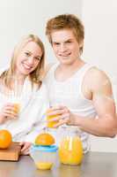 Breakfast happy couple make orange juice morning