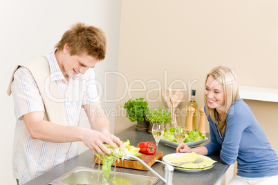 Lunch happy couple cook salad in kitchen