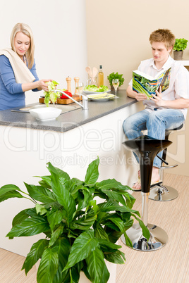 Lunch happy couple prepare salad in kitchen