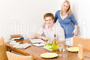 Happy couple man working on laptop kitchen