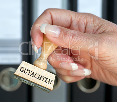 Gutachten - Stempel mit Hand