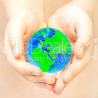 hand of the person holds globe