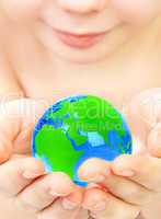 boy holds globe in hands