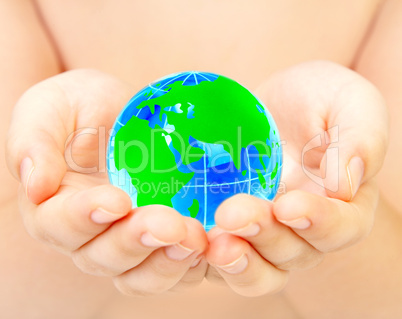 hand of the person holds globe