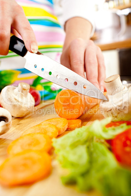 Woman's hands cutting vegetables