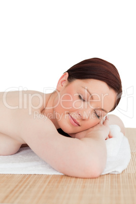 Good looking red-haired female relaxing in a spa centre