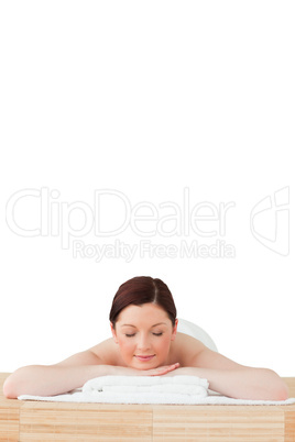 Pretty red-haired woman relaxing in a spa centre