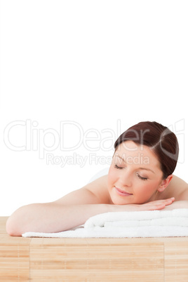 Gorgeous red-haired woman posing while relaxing in a spa centre
