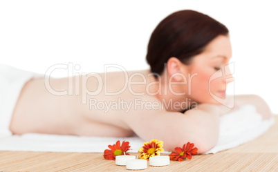 Young good looking red-haired female relaxing in a spa centre