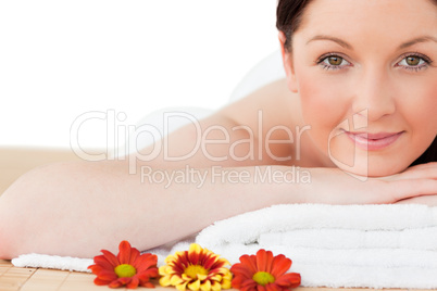 Portrait of a happy red-haired woman posing while relaxing in a