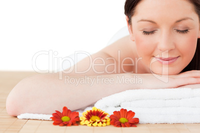 Portrait of a beautiful red-haired woman posing while relaxing i