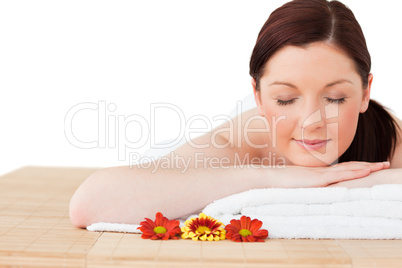 Portrait of an attractive red-haired woman posing while relaxing