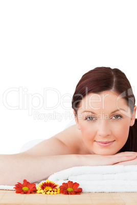 Portrait of a gorgeous red-haired woman posing while relaxing in