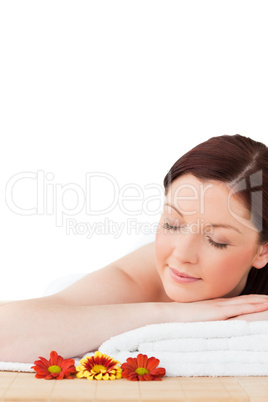 Portrait of a happy red-haired woman posing while relaxing in a