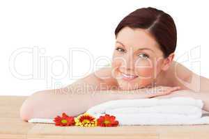 Portrait of a charming red-haired woman posing while relaxing in