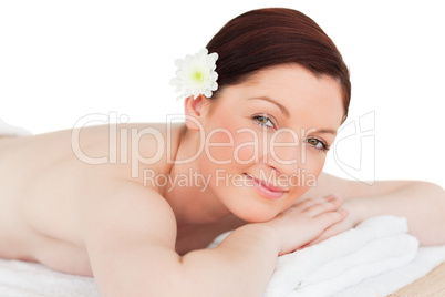 Portrait of a happy red-haired woman posing while relaxing in a