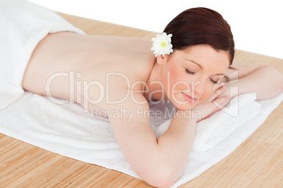 Portrait of a beautiful serene woman posing while relaxing in a