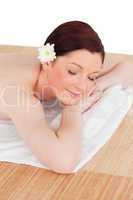 Portrait of a good looking serene woman posing while relaxing in