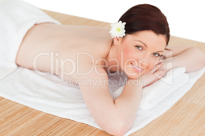 Portrait of an attractive serene woman posing while relaxing in