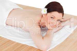 Portrait of an attractive serene woman posing while relaxing in