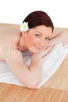 Portrait of a gorgeous serene woman posing while relaxing in a s