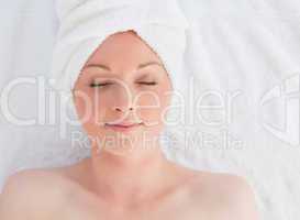 Closeup of a beautiful serene woman posing while relaxing in a s