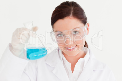 Pretty scientist looking at the camera in a laboratory