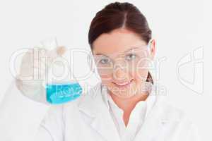 Pretty scientist looking at the camera in a laboratory