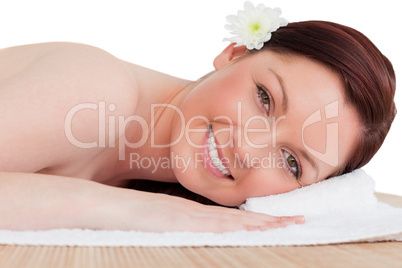 Portrait of a beautiful red-haired woman posing while relaxing i