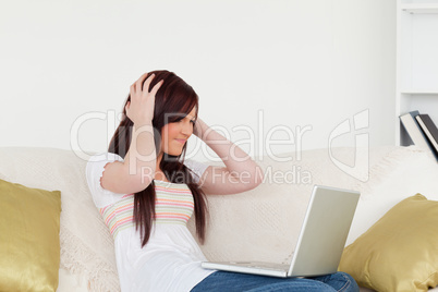 Attractive red-haired woman being depressed after gambling with