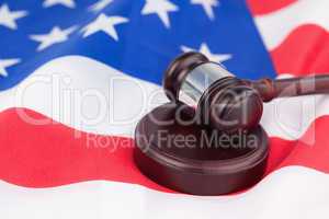 US flag and brown gavel