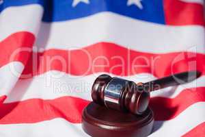 US flag and brown gavel