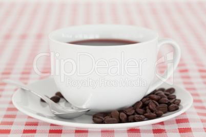 Coffee and beans on a tablecloth