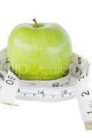 Closeup of a green apple circled with a tape measure